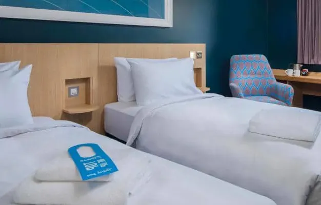 Photo of the bed in a Standard Twin Room in Fleet hotel