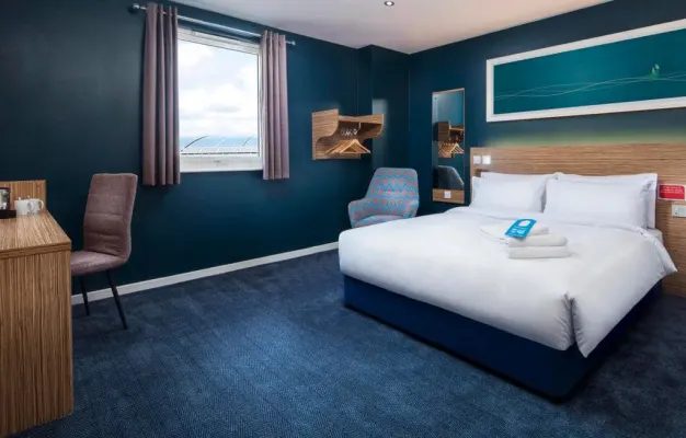 Photo of the bed in a Standard Accessible Room in Fort William hotel