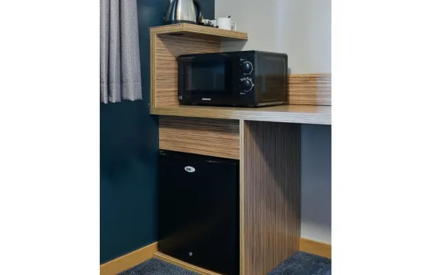 Photo of the bed in a Standard Room with Fridge & Microwave in Thame hotel